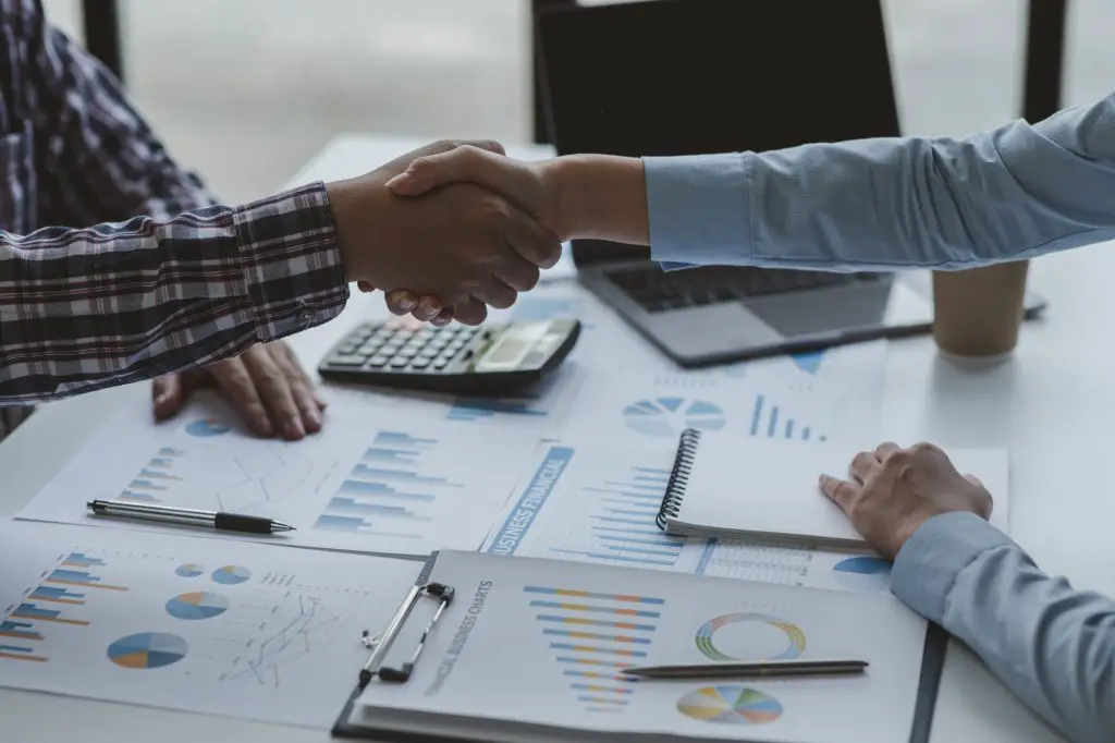 Business handshake for teamwork of business merger and acquisition,successful negotiate,hand shake,