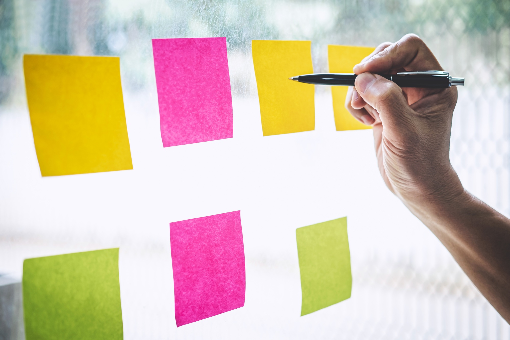 Businessman use post it notes to planning idea and business marketing strategy