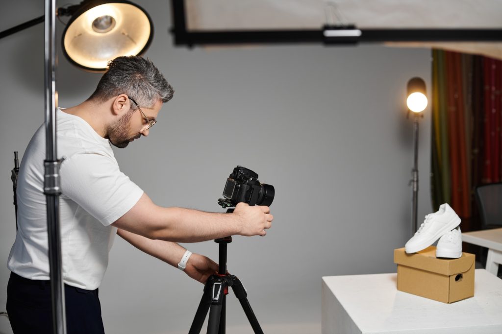 Creative man capturing product images in a modern studio workspace