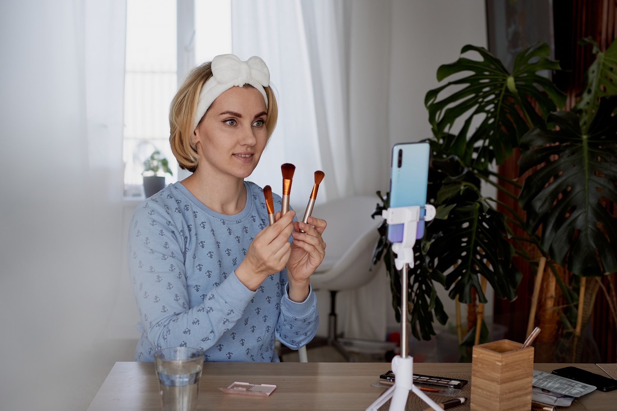 girl blogger tells subscribers about skin care and makeup Blogging, broadcast and cosmetics concept