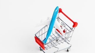Mini Shopping Cart On The Table. Business , e-commerce concept