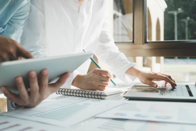 Team work process. Young business managers crew working with new startup project.